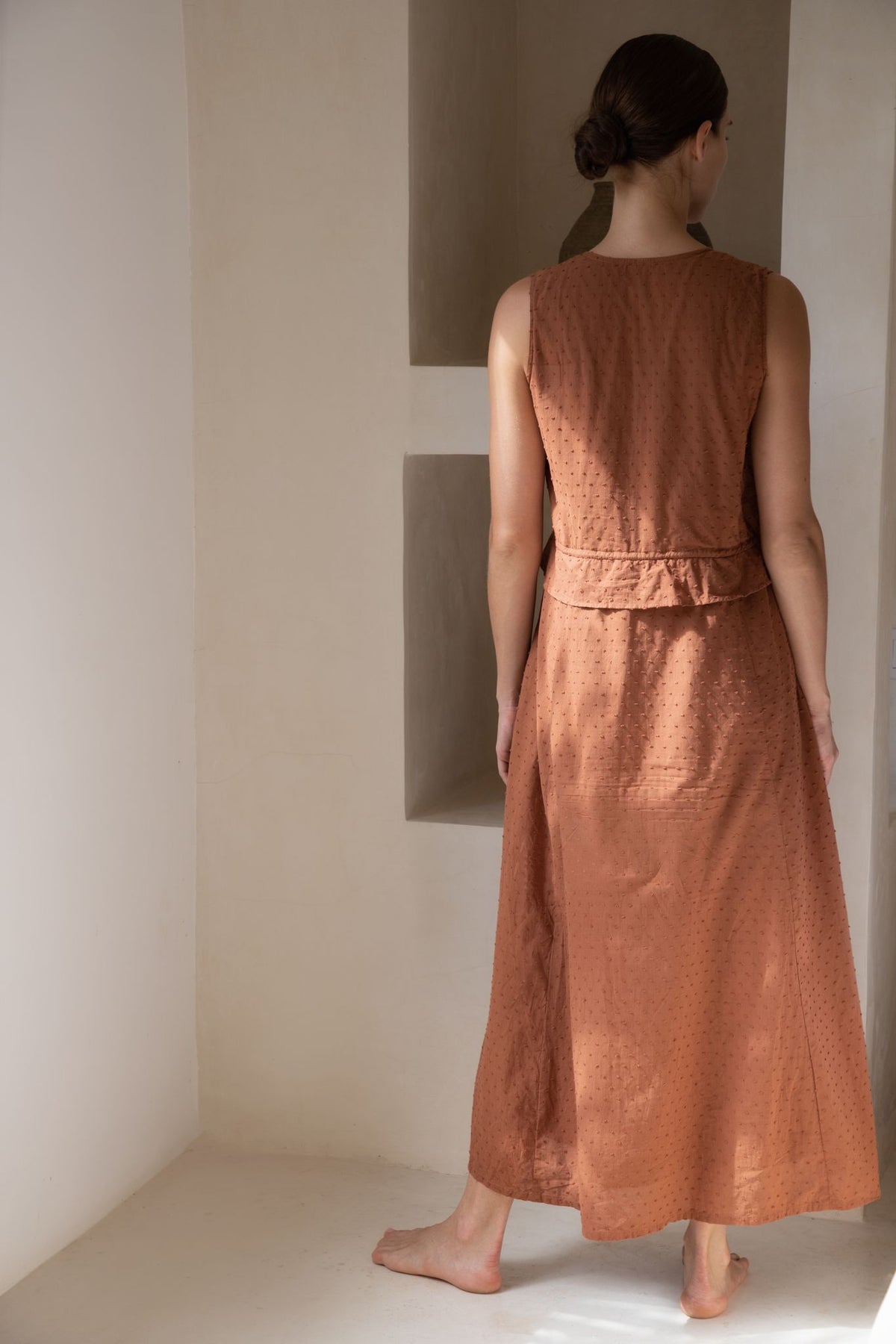 Rear look at rust coloured bridesmaid dress