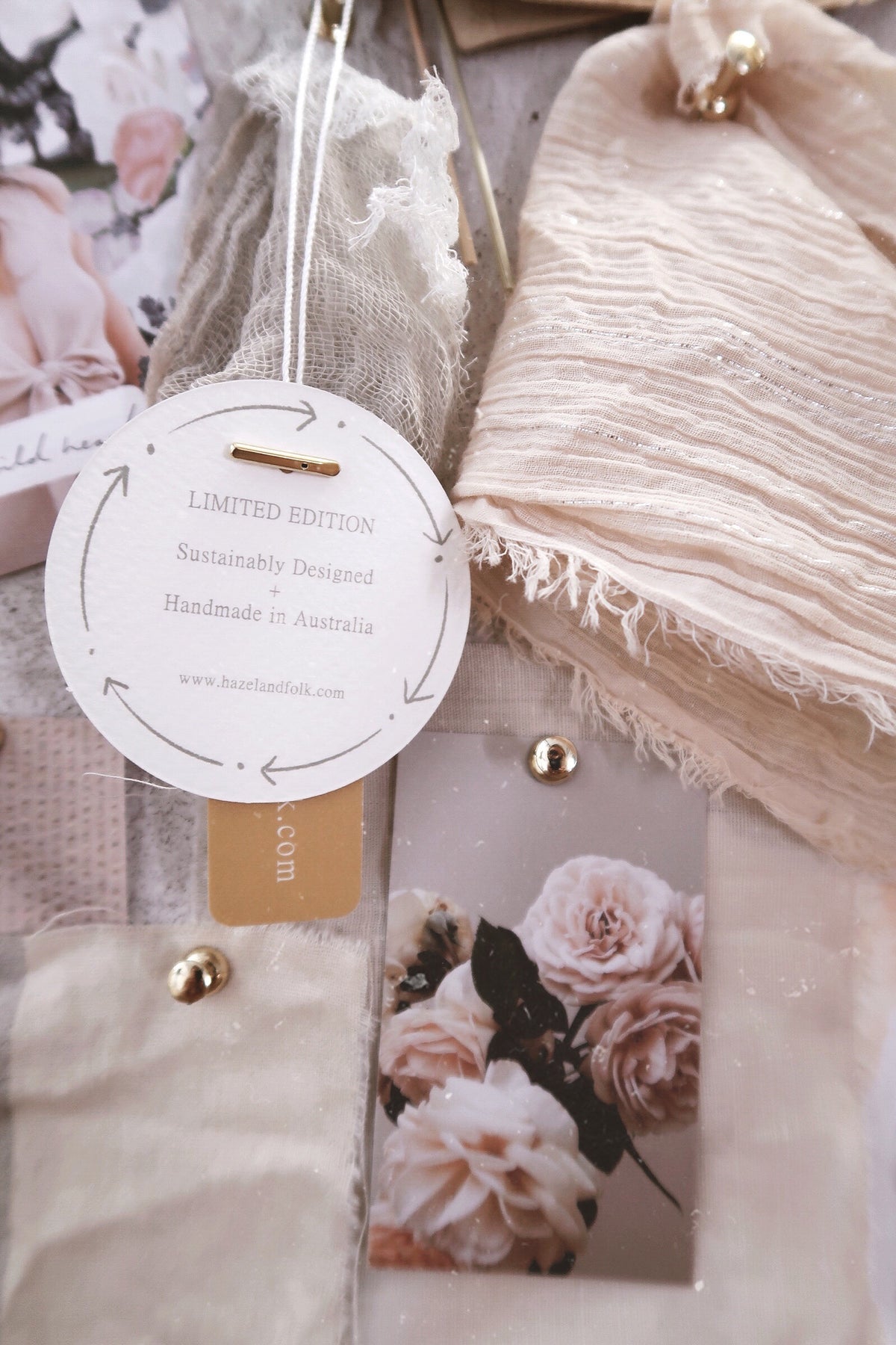 Fabrics and crafts with picture of flowers and round paper logo