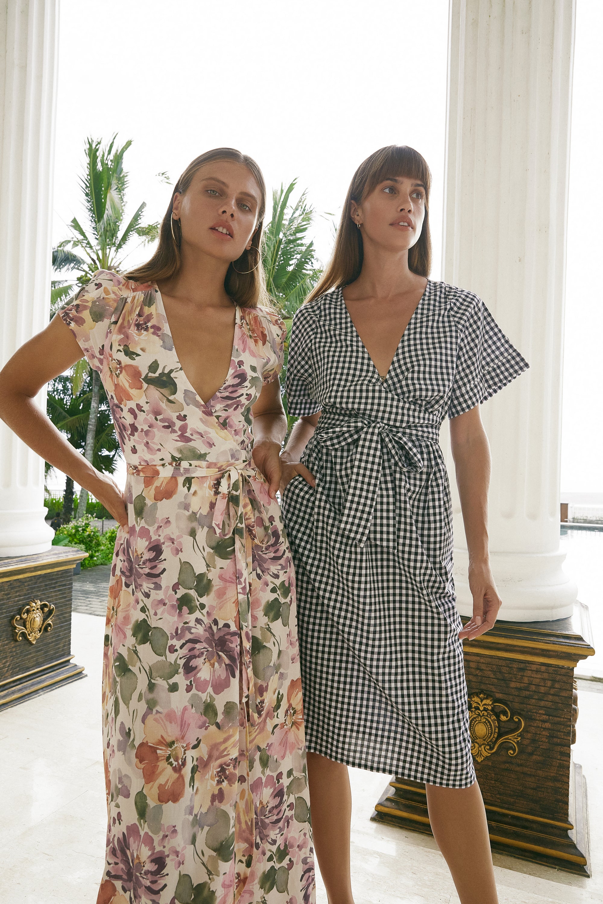 Two women modelling wearing printed dresses